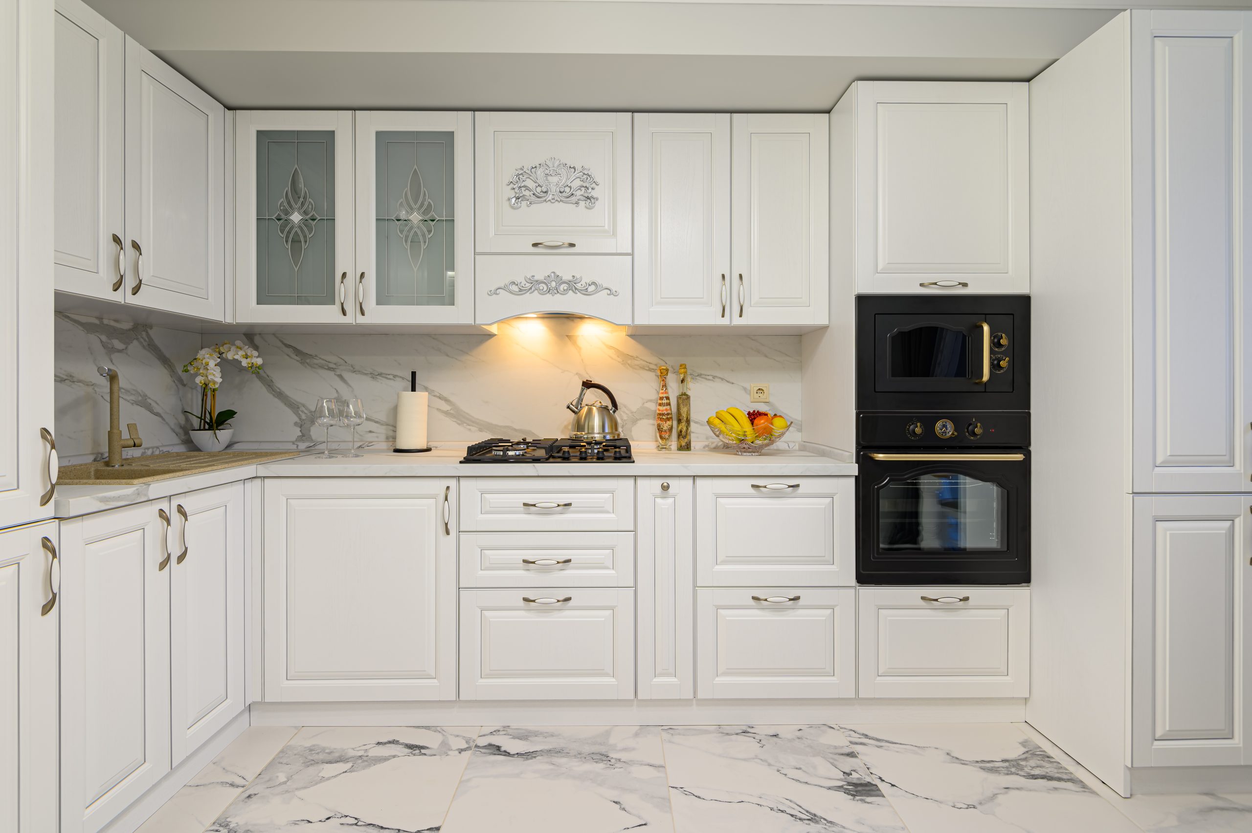 Oak kitchen cabinet doors spray painted white with high-gloss finish