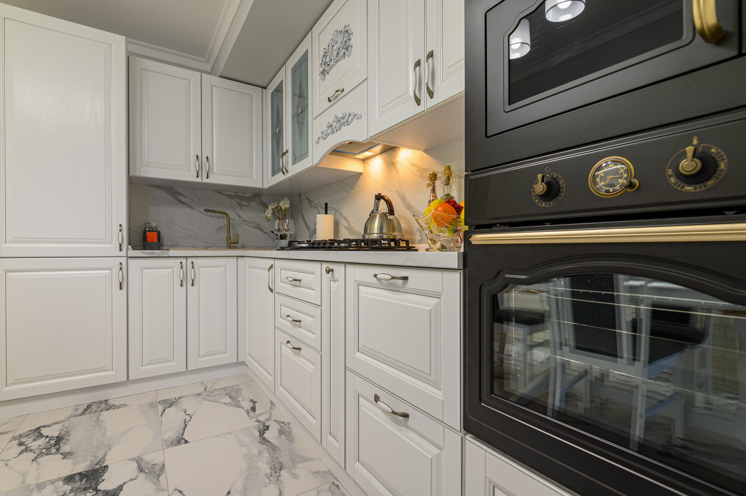 White high-gloss oak cabinet doors refinished with spray painting