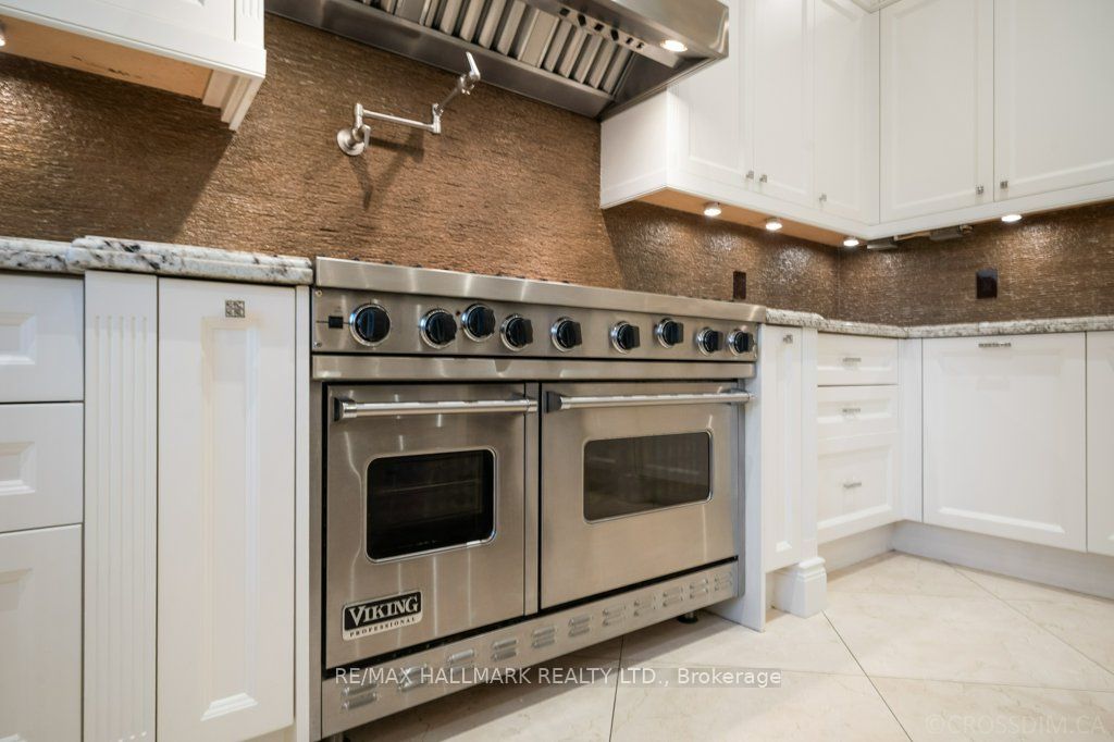 Cabinet Spray Painting in White dove colour by benjamin moore presale upgrade for toronto real estate market in richmond hill.