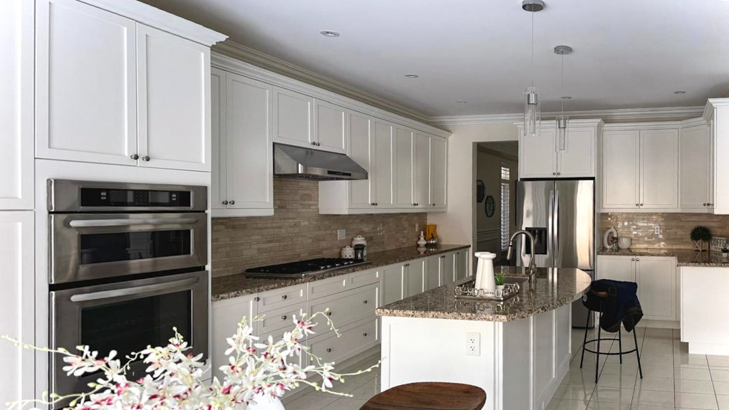 Close-up of a kitchen cabinet door in Markham, Toronto, after professional repainting and refinishing, showcasing a smooth, spray-applied finish.