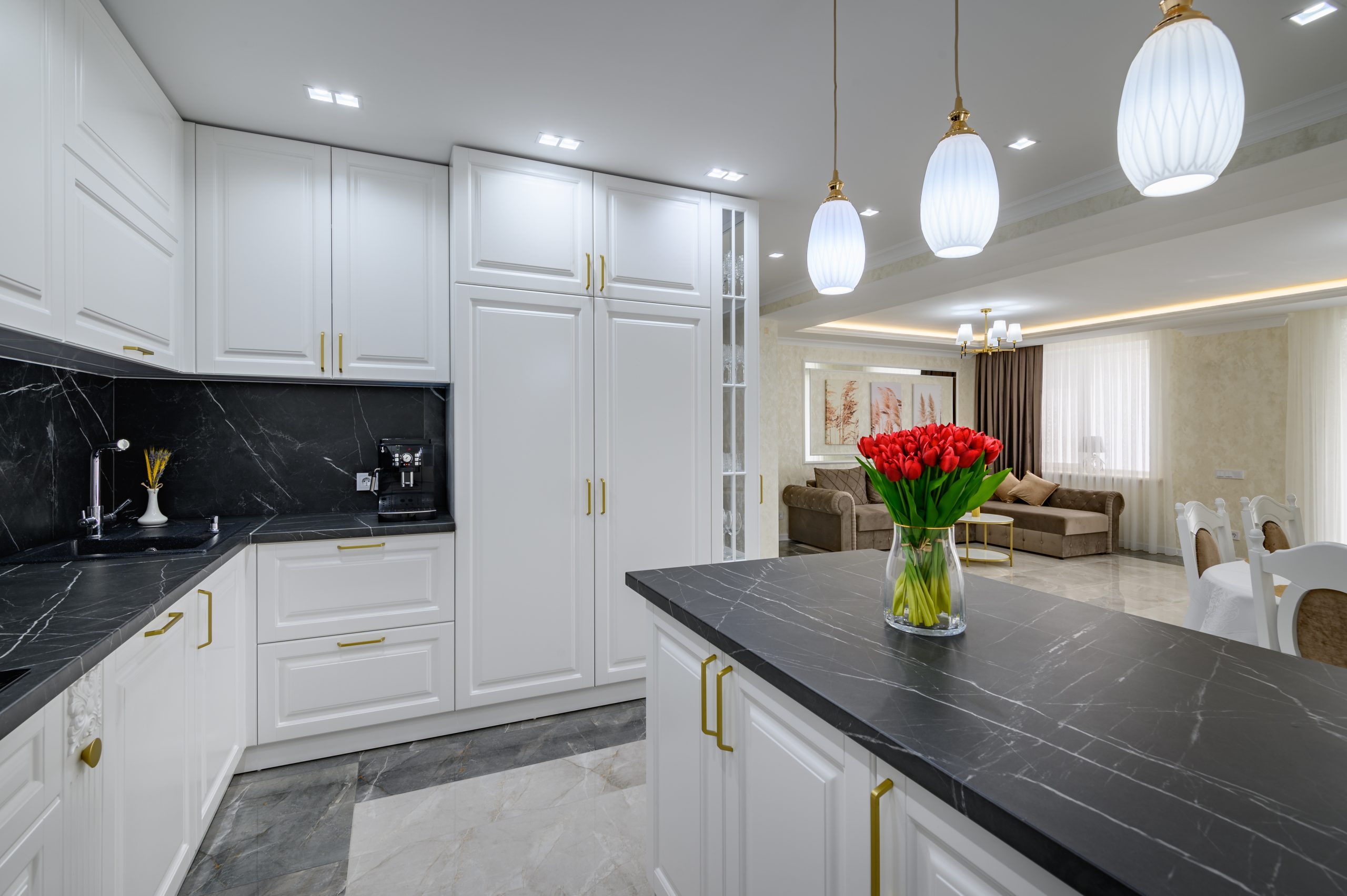 Cabinet painting with sleek gold handles installation in a bright, modern home located in Chaplin Estate, Toronto.