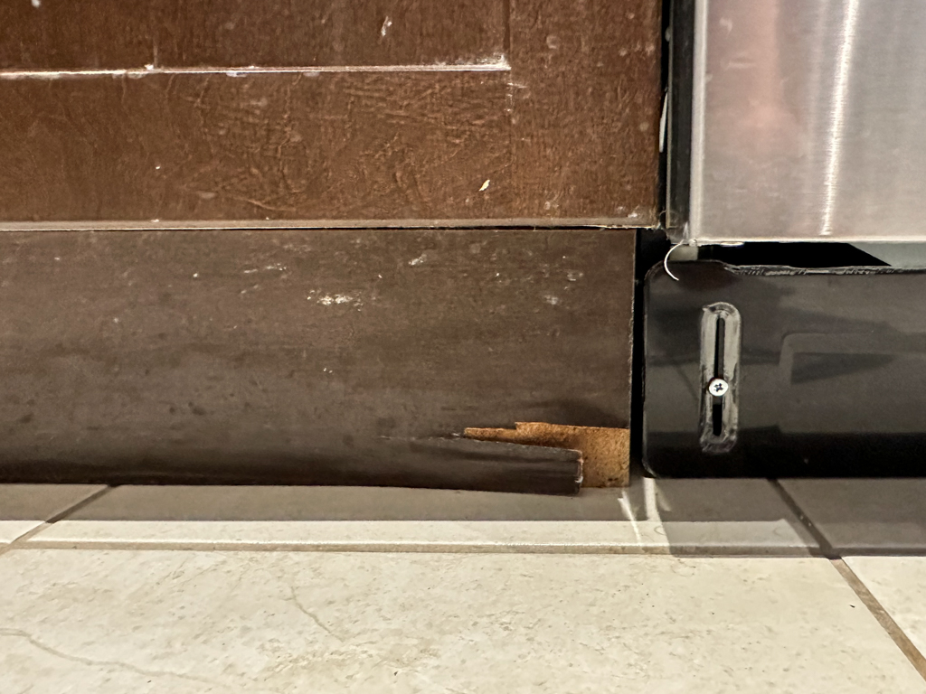 Before photo of dark brown stained cabinets with visible surface wear and fading, showing the need for professional refinishing.