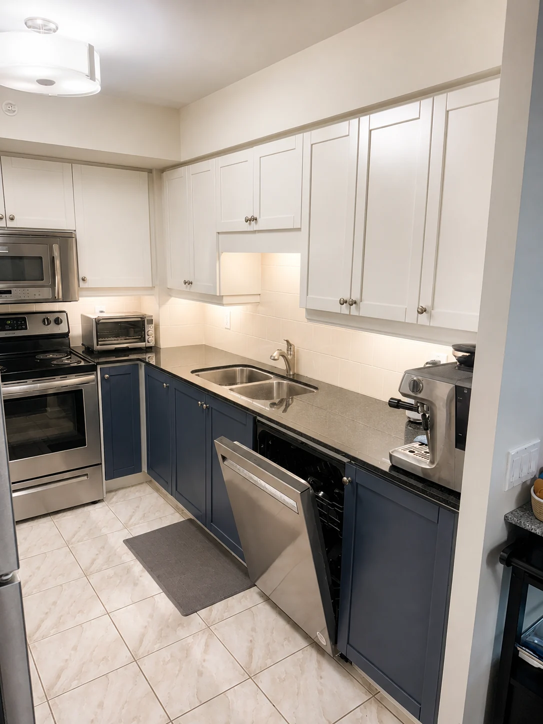 Fresh white and navy kitchen cabinet painting Toronto condo